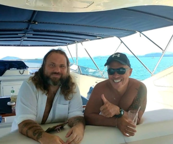 Karol Krauser with client aboard private superyacht off Phuket Thailand coast demonstrating seven-star service