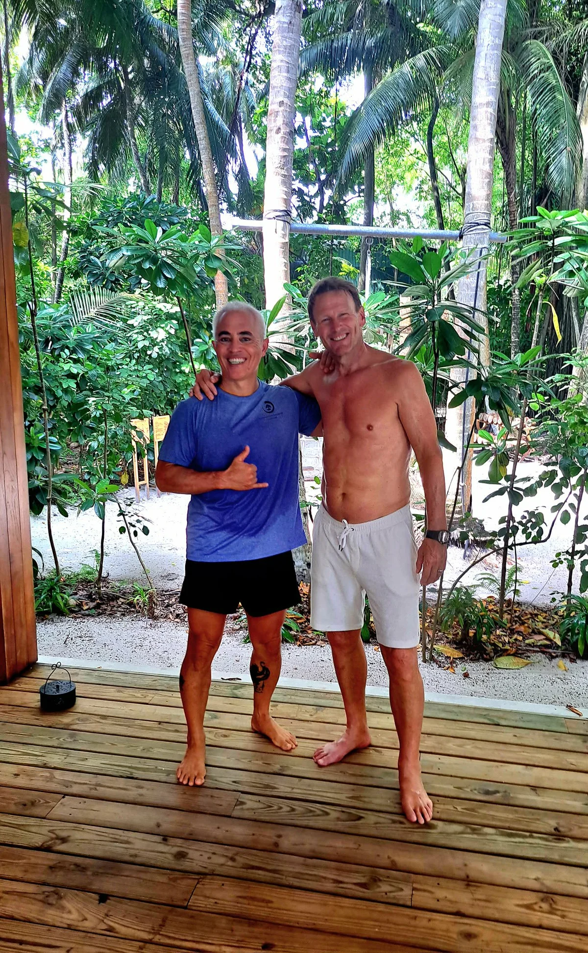 Karol Krauser with private wellness retreat client at tropical resort in Southeast Asia