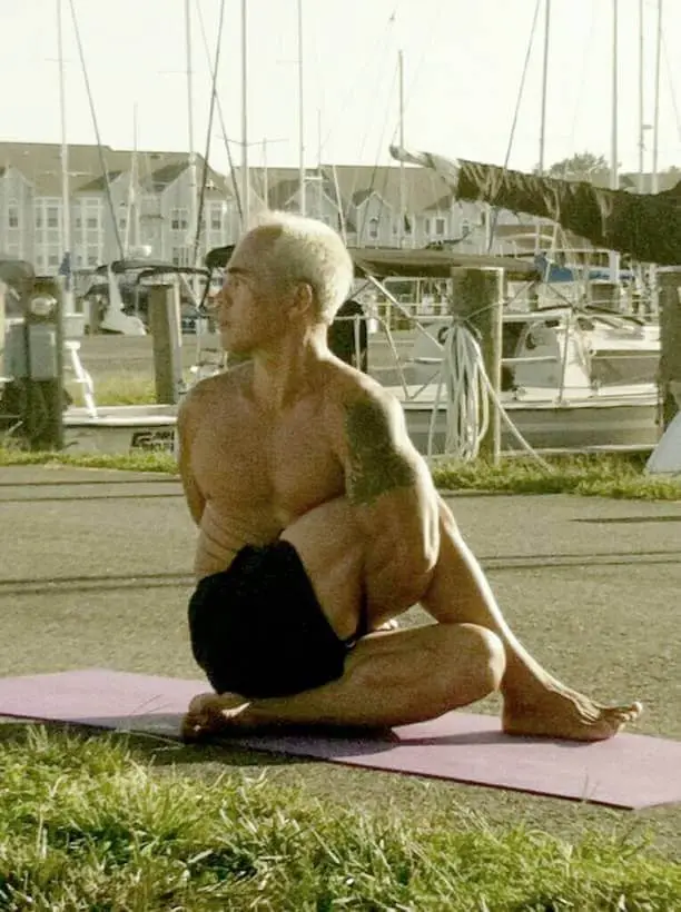 Karol Krauser practicing yoga at marina